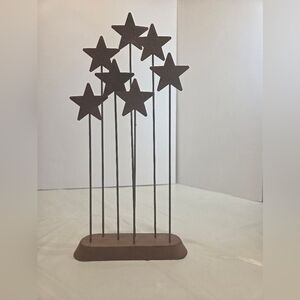 The Willow Tree Metal Star Backdrop, a collectible accessory designed by Susan L